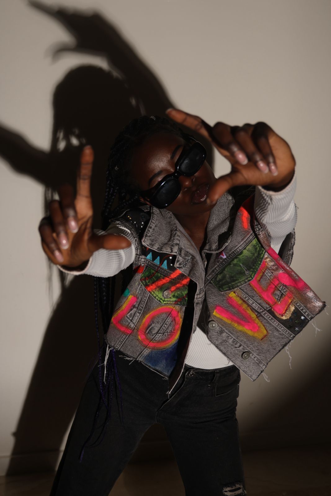 Fashion portrait with graphic vest and dramatic shadow